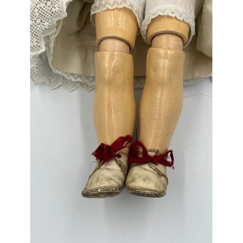 1073 - An Armand Marseille bisque headed doll marked 390 A.11.M. with weighted brown sleeping eyes, open mo... 