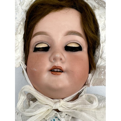 1073 - An Armand Marseille bisque headed doll marked 390 A.11.M. with weighted brown sleeping eyes, open mo... 