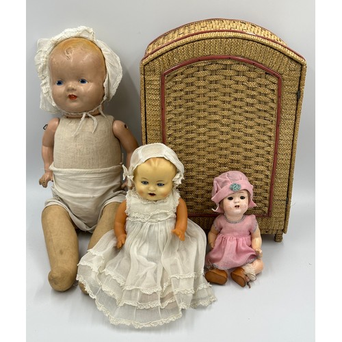 1075 - A collection of three early 20thC bisque headed dolls of various sizes together with a doll's vintag... 