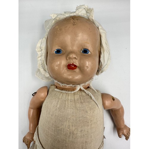 1075 - A collection of three early 20thC bisque headed dolls of various sizes together with a doll's vintag... 