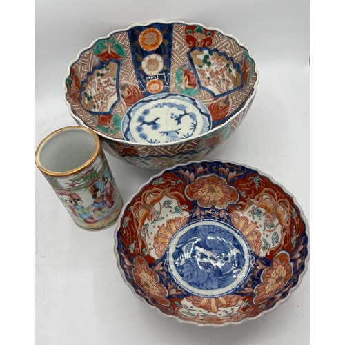 1167 - Two 19thC Imari bowls, largest 25cm d and a Chinese vase 12cm h.