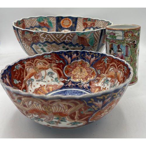 1167 - Two 19thC Imari bowls, largest 25cm d and a Chinese vase 12cm h.