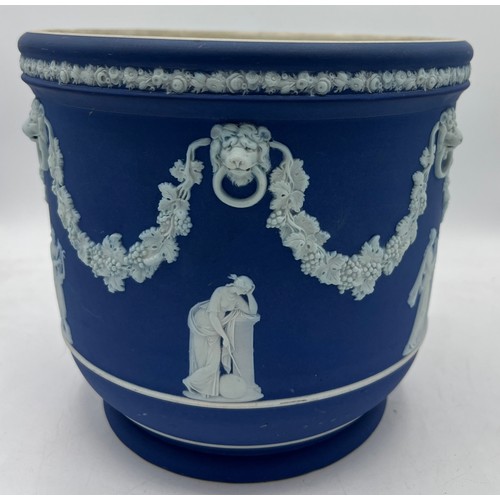 210 - Wedgwood blue Jasperware jardinière decorated with classical figures and swags. 19cm h 20cm d.