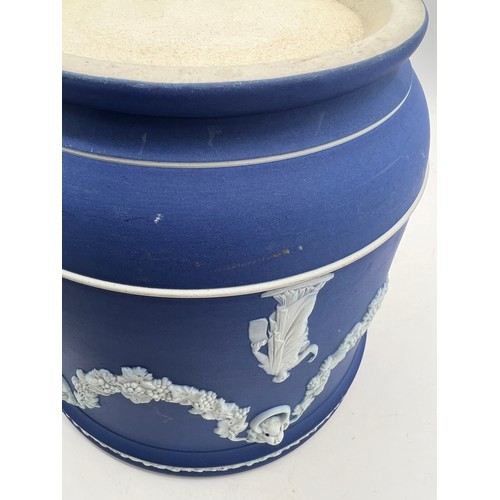 210 - Wedgwood blue Jasperware jardinière decorated with classical figures and swags. 19cm h 20cm d.