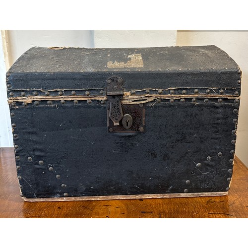 1281 - Local interest. A small wooden trunk with metal carrying handles and studs and label to interior for... 