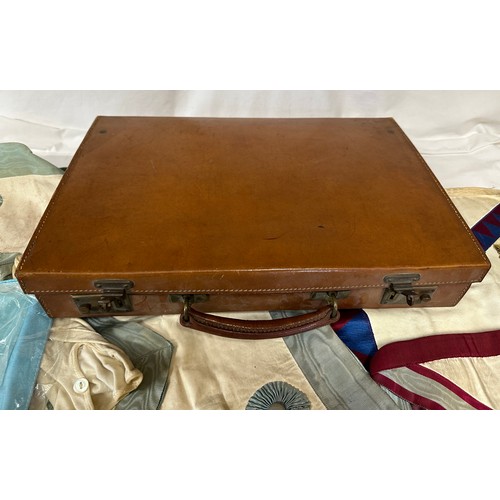 1284 - A leather briefcase containing Masons regalia, majority aprons etc related to St Cuthbert's Lodge, H... 