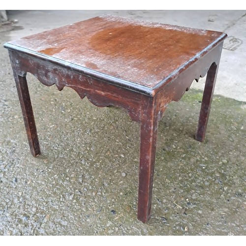 30 - A mahogany side table on square tapered legs. 33 x 38 x 37cm.