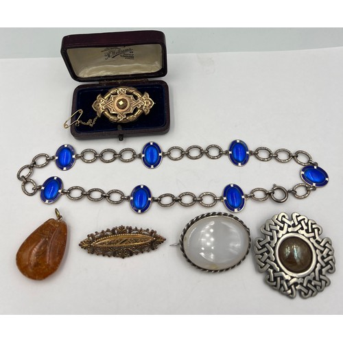 381 - Jewellery to include a Norwegian sterling silver and enamel necklace, brooches and amber pendant.