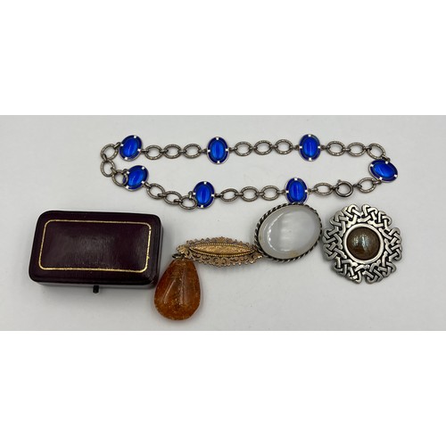 381 - Jewellery to include a Norwegian sterling silver and enamel necklace, brooches and amber pendant.