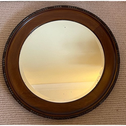 1227 - A mahogany circular bevel edged wall mirror. 47cm d.