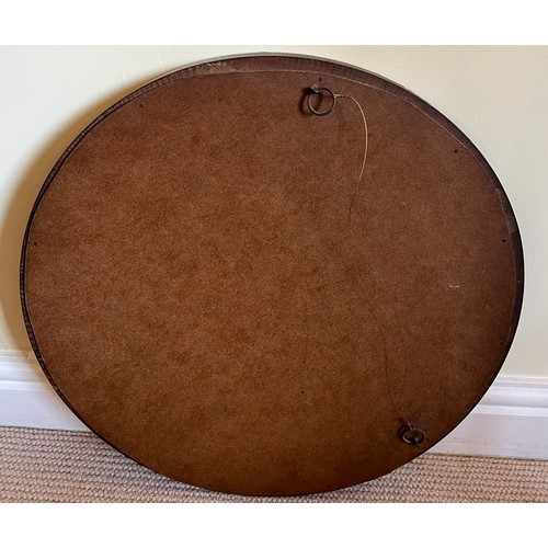 1227 - A mahogany circular bevel edged wall mirror. 47cm d.