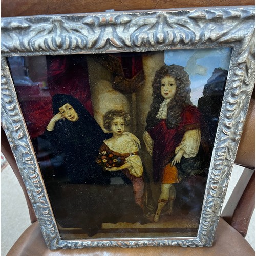 1406 - A reverse painted study of family group in carved giltwood frame. 31cm x 24cm.