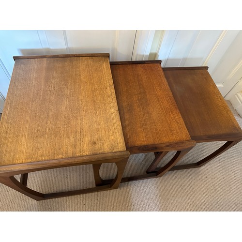 27 - A nest of three teak tables, largest 53 w x 43 d x 48cm h together with a mid century stool with ori... 