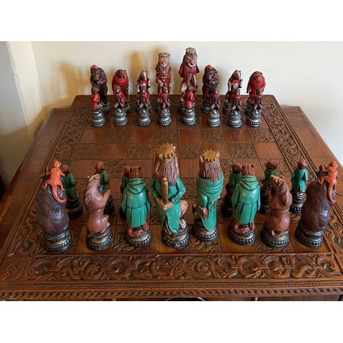 1294 - A vintage resin chess set and board. Board 60cm x 60cm.