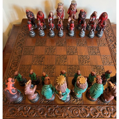 1294 - A vintage resin chess set and board. Board 60cm x 60cm.