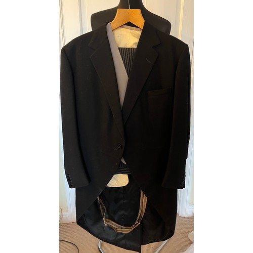 940 - A vintage gentleman’s morning suit comprising jacket, trousers and waistcoat. Label Strachan & Hunt ... 