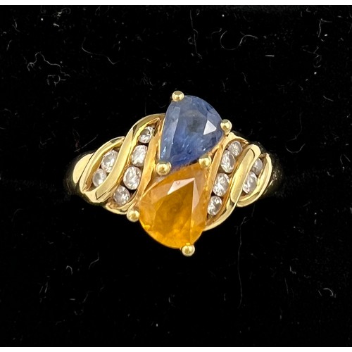 394 - An 18 carat yellow gold ring set with blue and yellow sapphires with diamonds. Size M, weight 5.1gm.