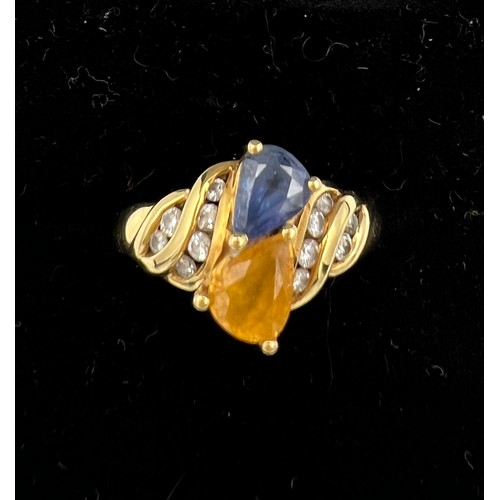 394 - An 18 carat yellow gold ring set with blue and yellow sapphires with diamonds. Size M, weight 5.1gm.