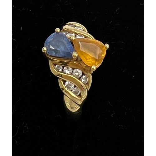 394 - An 18 carat yellow gold ring set with blue and yellow sapphires with diamonds. Size M, weight 5.1gm.