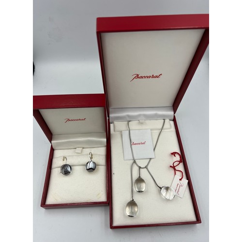 395 - Baccarat Tentation pendant and earrings in original boxes both set in silver.