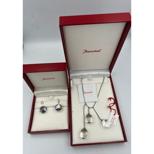 395 - Baccarat Tentation pendant and earrings in original boxes both set in silver.