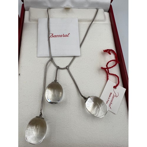 395 - Baccarat Tentation pendant and earrings in original boxes both set in silver.