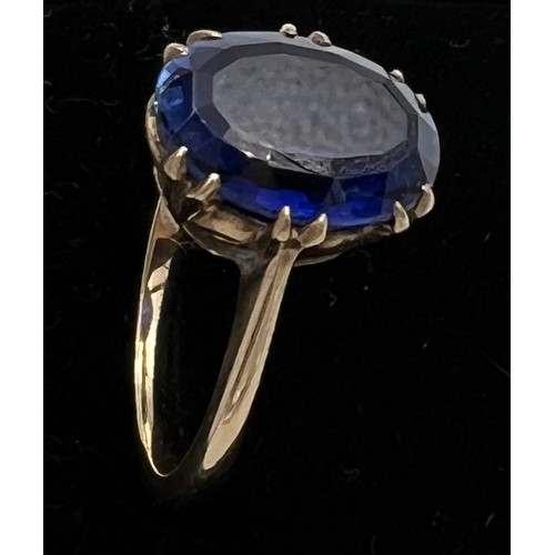 398 - A 9 carat golds ring set with blue stone. Size N, weight 4gm.