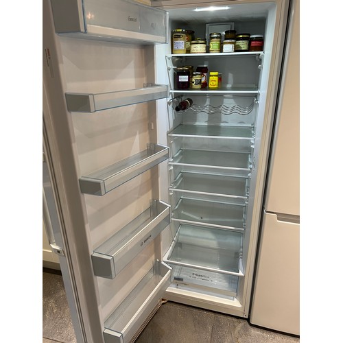 1248 - A Bosch high fridge with single door. 59cm w x 176cm h.