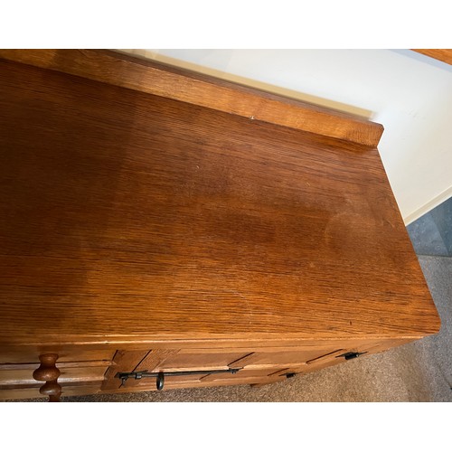 96 - A Rabbitman Peter Heap of Wetwang oak sideboard with adzed top having cupboard to each side and draw... 