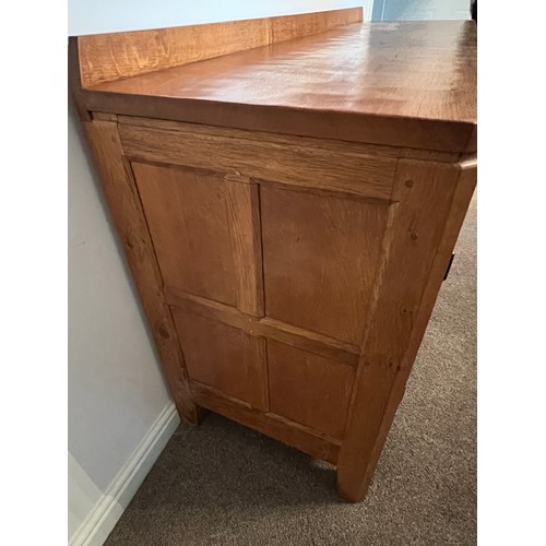 96 - A Rabbitman Peter Heap of Wetwang oak sideboard with adzed top having cupboard to each side and draw... 