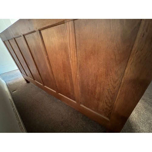 96 - A Rabbitman Peter Heap of Wetwang oak sideboard with adzed top having cupboard to each side and draw... 