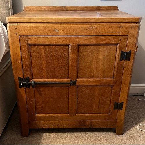 97 - An oak Rabbitman Peter Heap of Wetwang bedside cupboard each with single panelled door and sides. 61... 