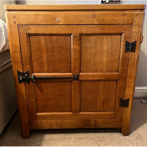 97 - An oak Rabbitman Peter Heap of Wetwang bedside cupboard each with single panelled door and sides. 61... 