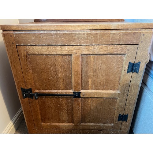 99 - An oak Rabbitman Peter Heap bedside cupboard with single panelled door and sides. 61cm w x 41cm d x ... 