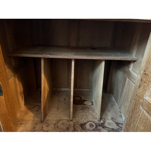 99 - An oak Rabbitman Peter Heap bedside cupboard with single panelled door and sides. 61cm w x 41cm d x ... 