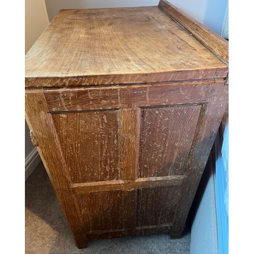 99 - An oak Rabbitman Peter Heap bedside cupboard with single panelled door and sides. 61cm w x 41cm d x ... 