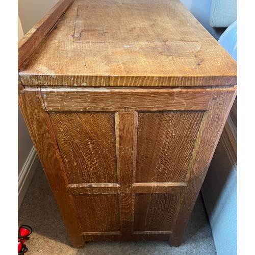 99 - An oak Rabbitman Peter Heap bedside cupboard with single panelled door and sides. 61cm w x 41cm d x ... 