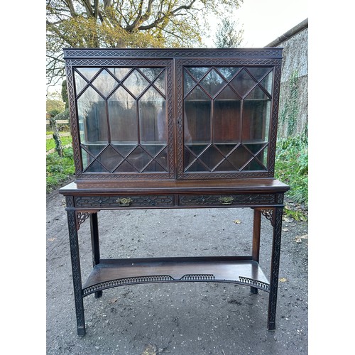 18 - Oriental style mahogany carved display cabinet with two shelves to interior and two shallow drawers.... 