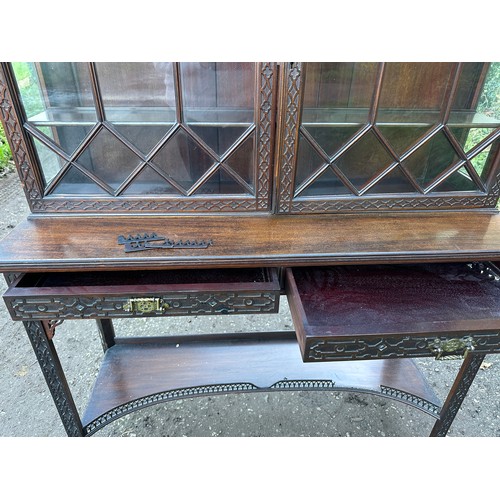 18 - Oriental style mahogany carved display cabinet with two shelves to interior and two shallow drawers.... 