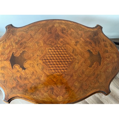 91 - A 19thC French marquetry inlaid centre table with ormolu mounts and drawer to one side. Inlaid with ... 