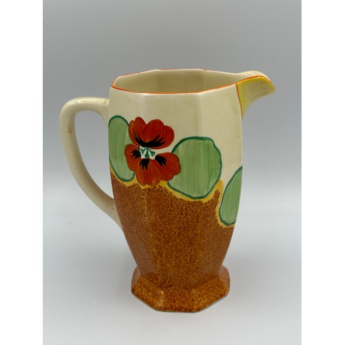 274 - A Clarice Cliff Bizarre Nasturtium pattern jug. 18cm h.