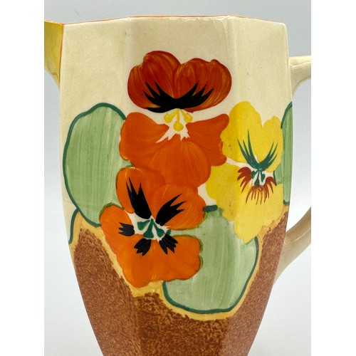 274 - A Clarice Cliff Bizarre Nasturtium pattern jug. 18cm h.