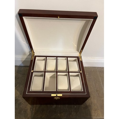 1173 - A good quality watch box with two interior display trays. 28cm x 24cm x 17cm.