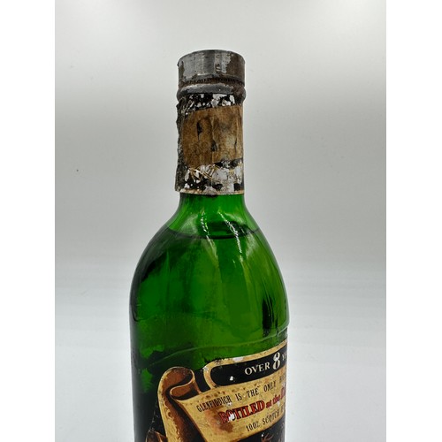 1137 - A bottle of Glenfiddich Pure Malt Scotch Whisky, over 8 years, Contents 26 2/3 Fl. ozs. Pre decimali... 