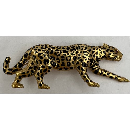 367 - A 18 carat gold leopard brooch with ruby eyes and black enamelled decoration Weight 9.1gm. 5cm l.