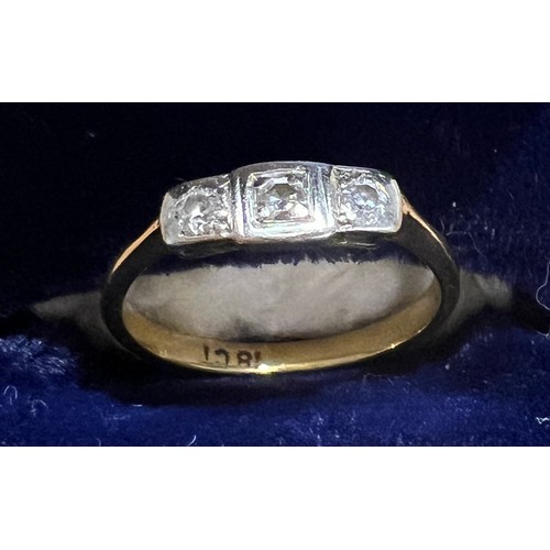 405 - An 18 carat gold ring set with 3 diamonds. Size M. Weight 2.5gm.