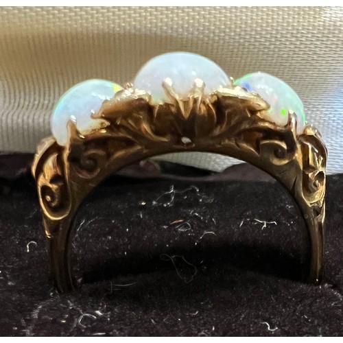 408 - A 19thC 18 carat gold ring set with opals and diamonds. Size L. Weight 4.5gm.