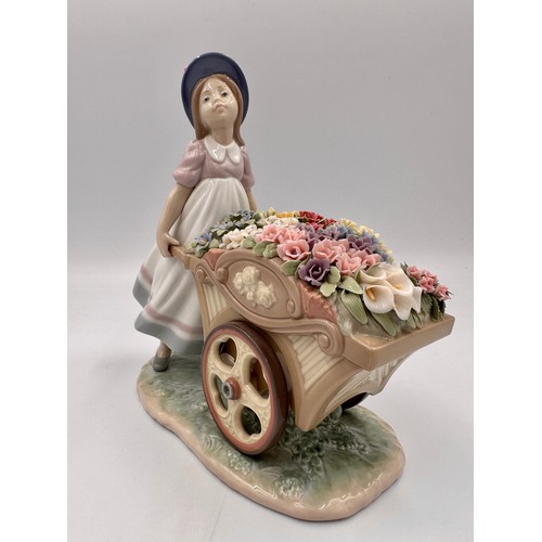 231 - A Lladro “Love’s Tender Tokens” figurine, marks to base & impressed number 6521, height 22.5cm h 23c... 