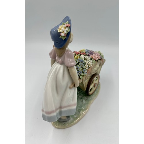 231 - A Lladro “Love’s Tender Tokens” figurine, marks to base & impressed number 6521, height 22.5cm h 23c... 