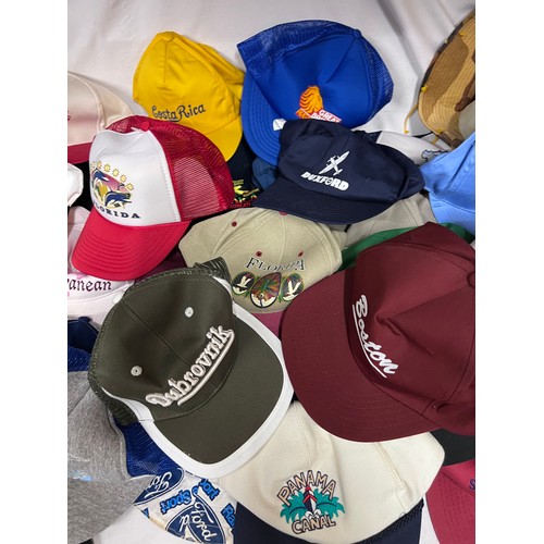 944 - A large quantity of mainly baseball caps collected over many years from multiple holiday destination... 